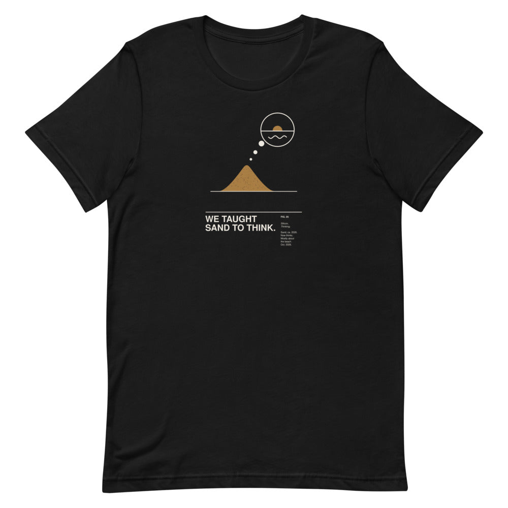 WE TAUGHT SAND TO THINK. black unisex T-shirt, flat-lay front view: a small ochre sand pile with a thought bubble rising from its tip showing a sunset over the sea, above the caption WE TAUGHT SAND TO THINK. – ALL4SI graphic tee